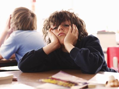 Student looking bored at school