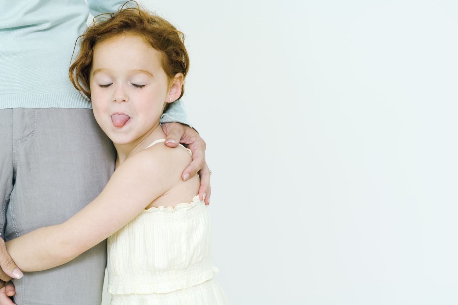 rude behavior in kids - girl sticking out her tongue