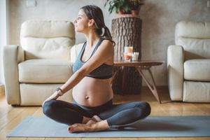 pregnant woman exercising at home