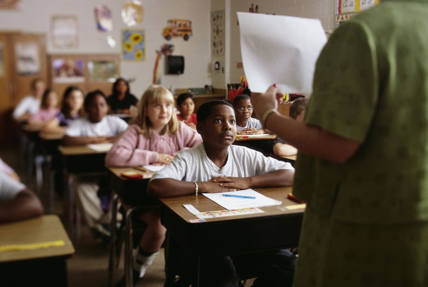 Children listening to teacher in classroom