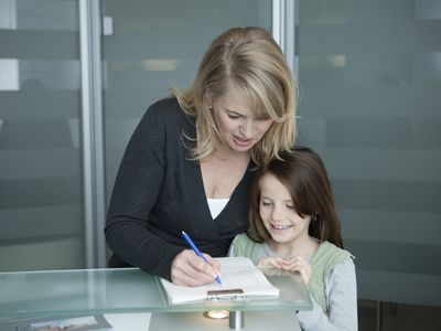 Mother with daughter filling out form