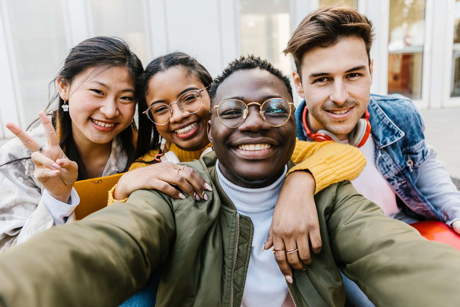 Group of 4 smiling teens