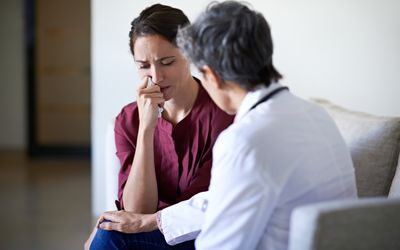 Patient talking with doctor