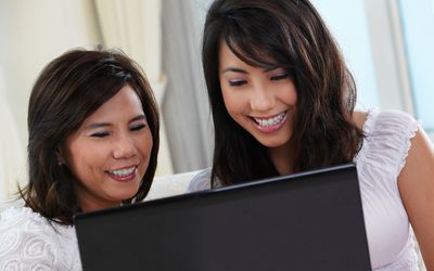 mom and daughter on a laptop