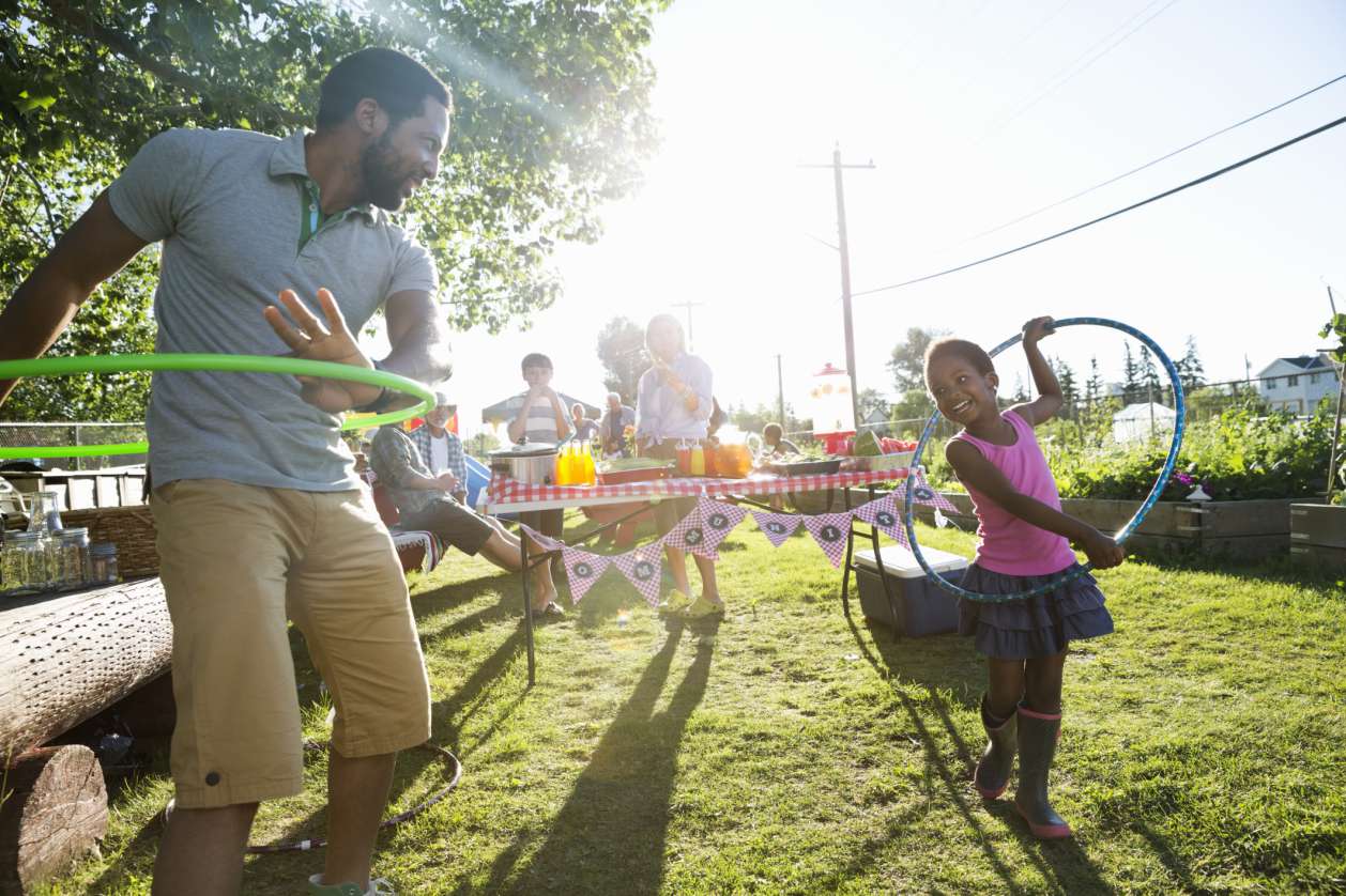 Dad and daughter with hula hoops