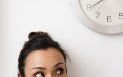 woman eyeing the clock