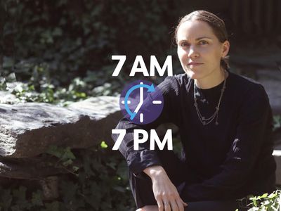 woman looking at camera sitting on rocks