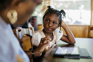 Young girl gets help at school