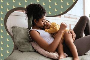 Mom holding sleeping child