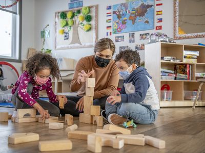 Kids and teacher at childcare facility