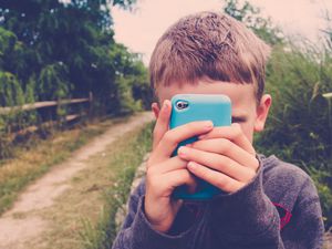 Young boy with a cell phone