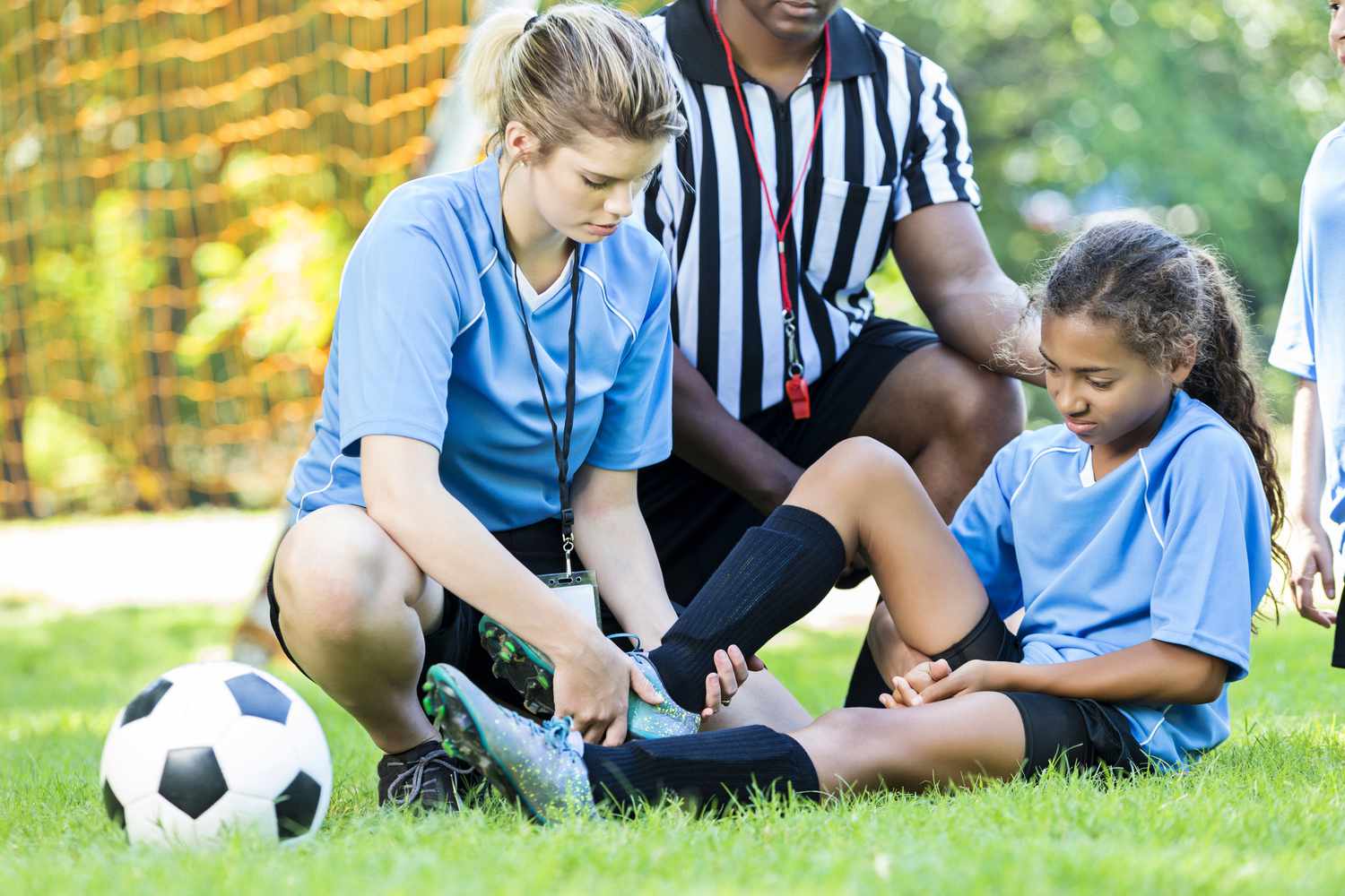 Young soccer player is injured during a match