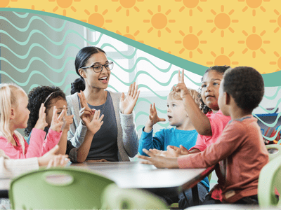 Children gathered around a table with a teacher