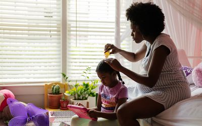 mom doing daughter's hair