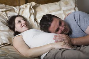 Partner Holding Mom's Pregnant Abdomen