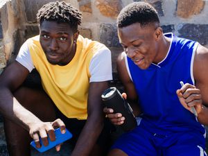 teen boys hanging out listening to music