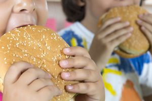 Boy And Girl With Hamburgers