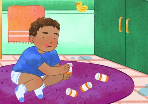 A child tries to open a pill bottle in the bathroom (How to Keep Medicines Safe From Kids)