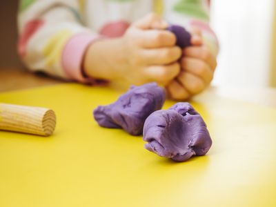 Child's hands kneading modelling clay