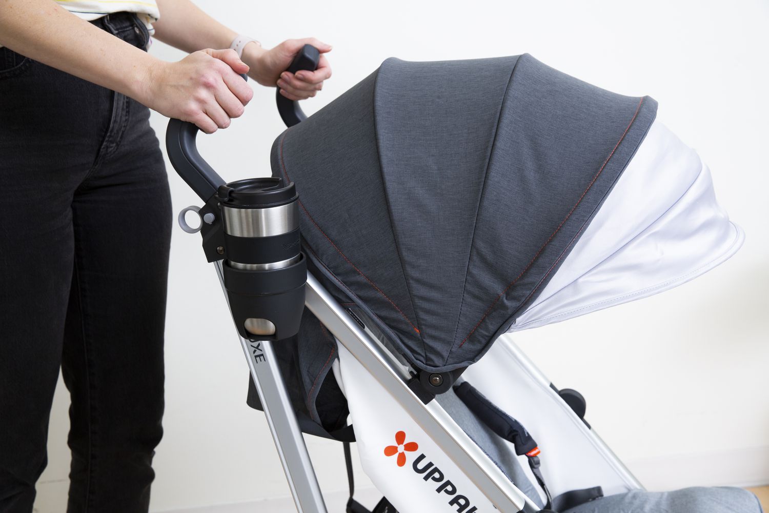 Person holding the handle of UPPAbaby Jake G-LUXE Stroller