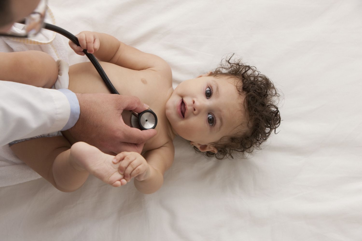 baby being examined by a pediatrician