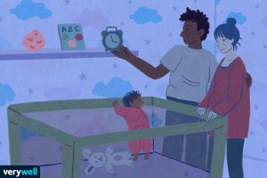 illustration of parents standing over baby's crib, dad is holding a clock