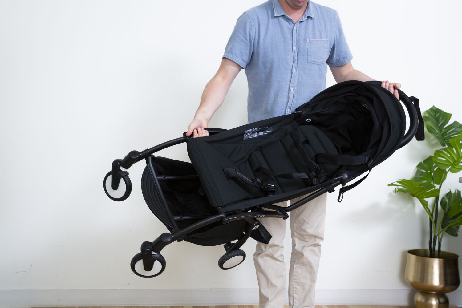 Person holding Babyzen YOYO2 Stroller Frame