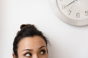 woman eyeing the clock