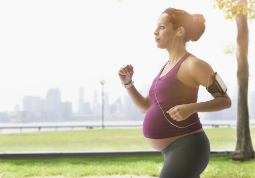 Pregnant woman exercising outside