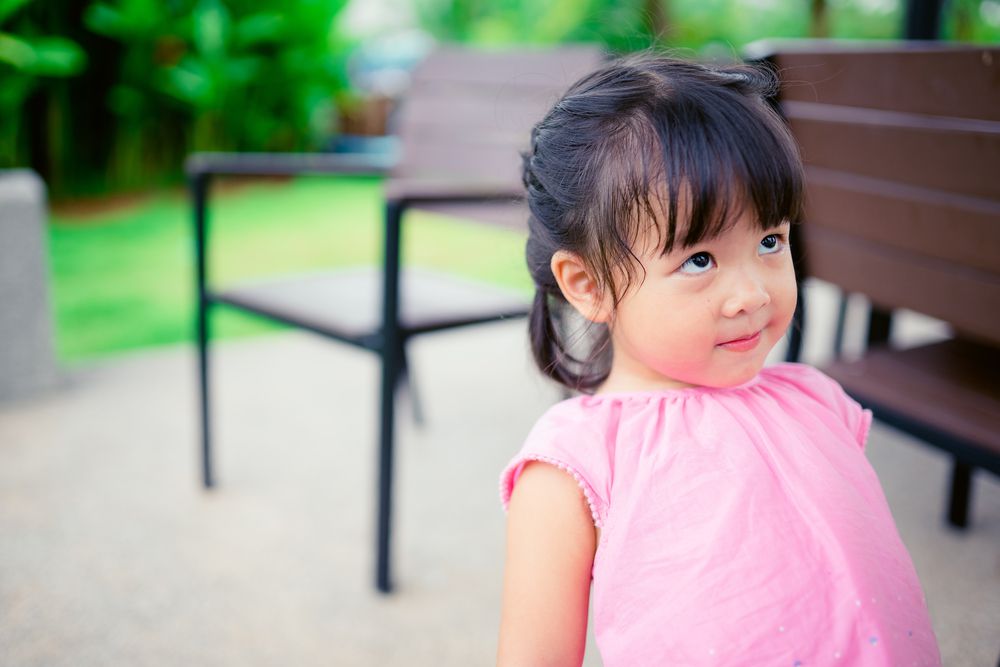 Little girl looking up