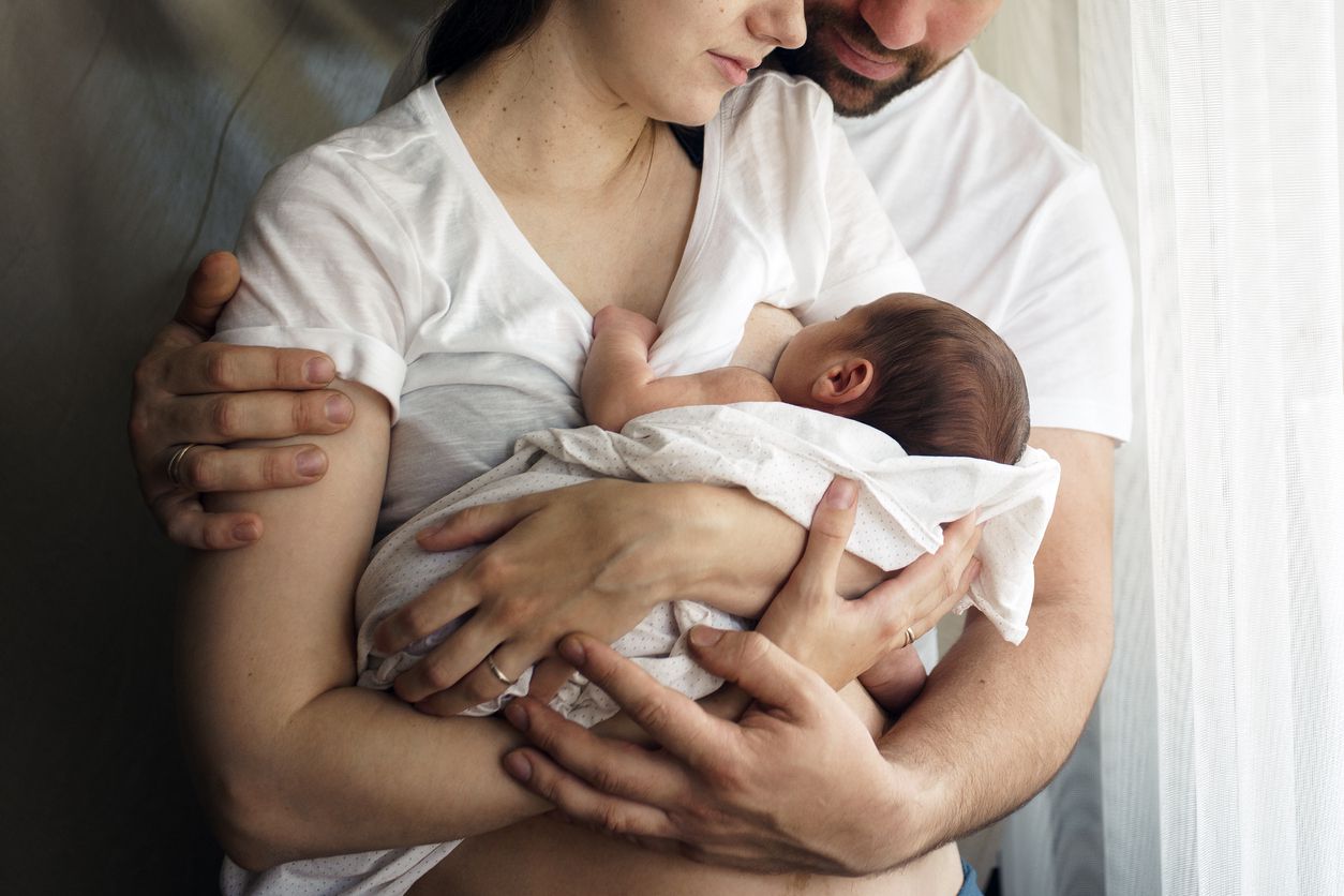 mom and dad with a newborn
