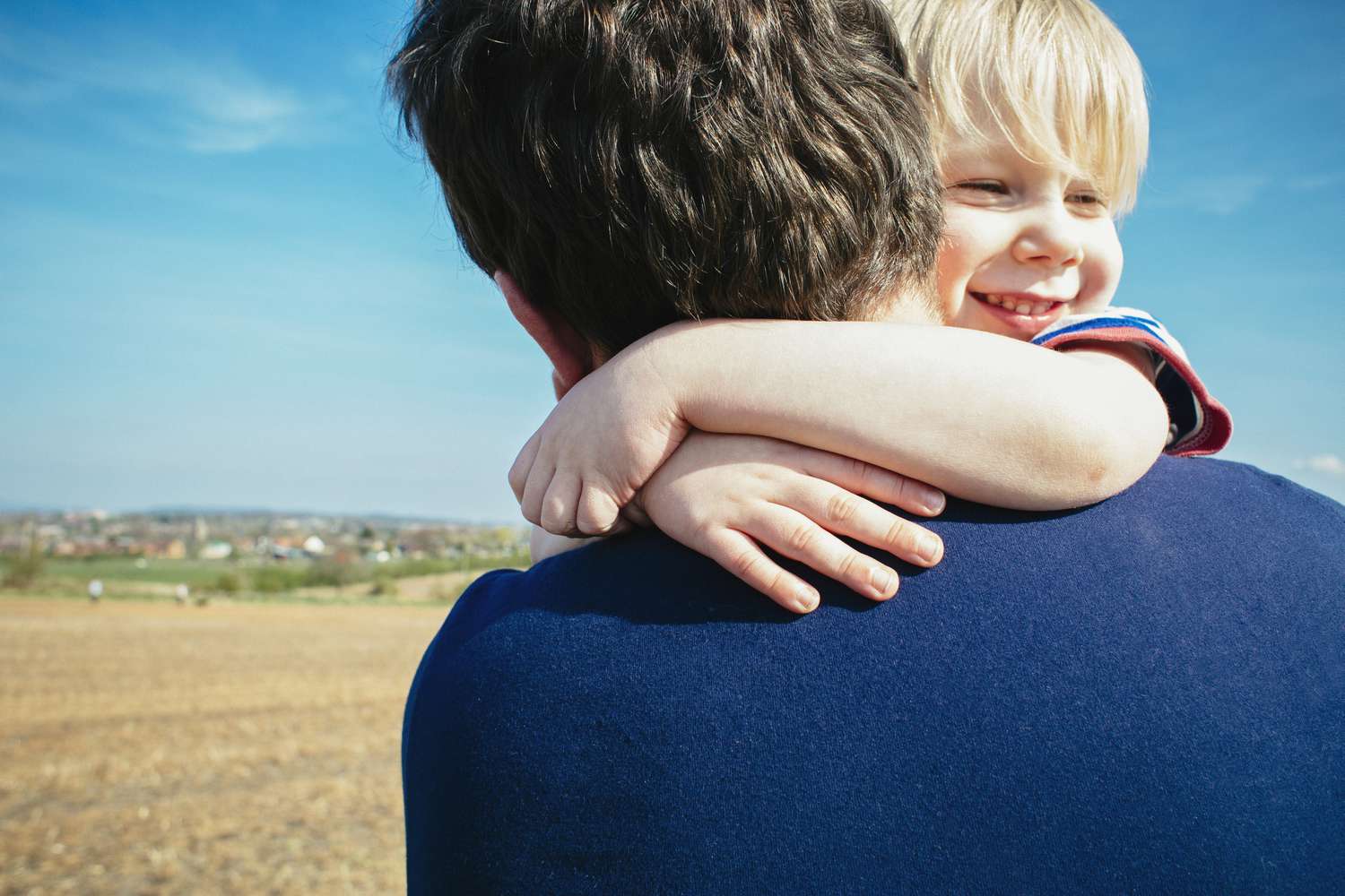 Father and son hugging