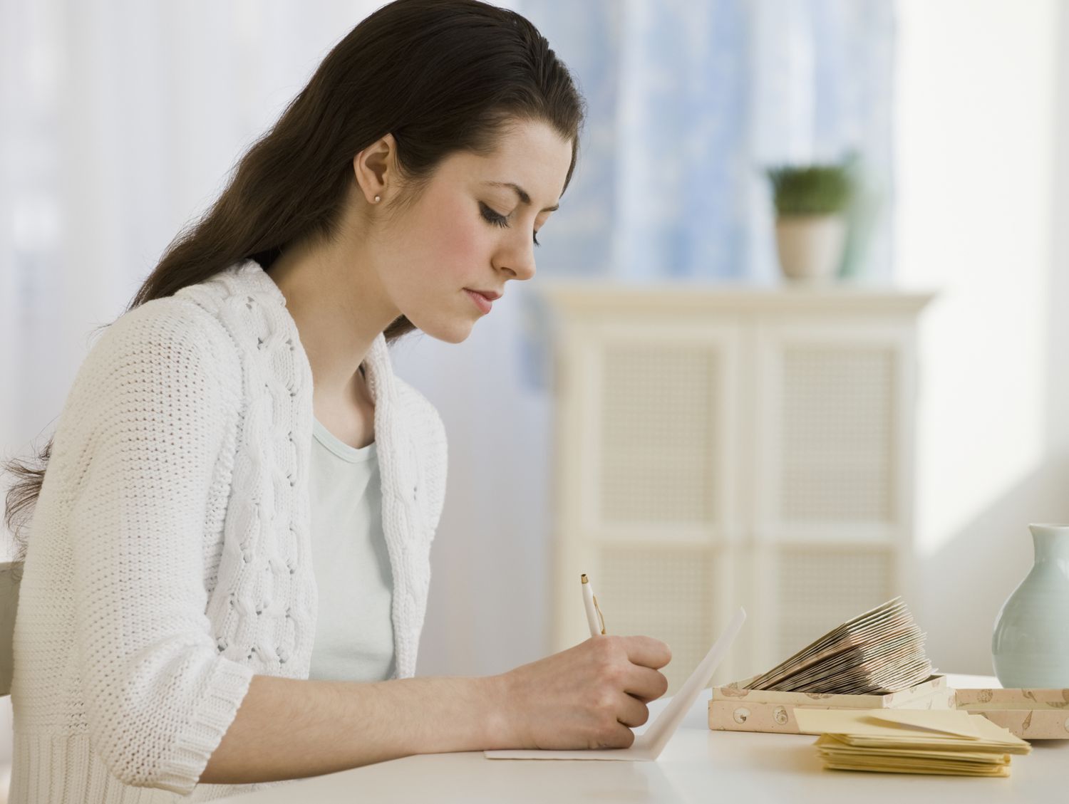 woman writing on card