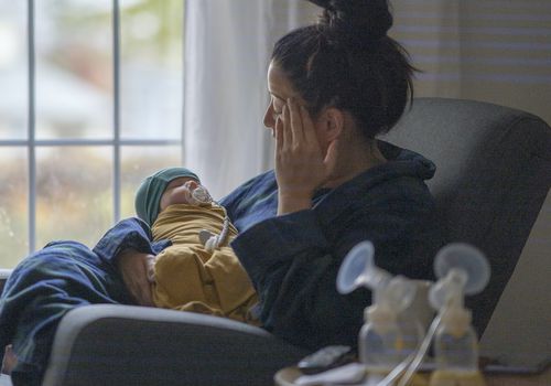 Mother holding newborn baby