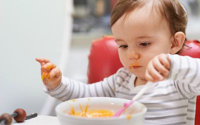 a toddler eating