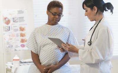 pregnant person with an OB/GYN